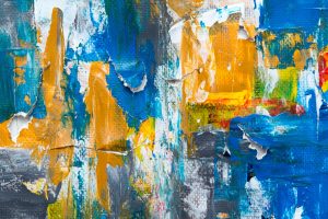 Colorful layered textures in a modern abstract painting provide vibrant energy.