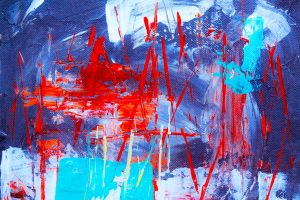 Dynamic abstract painting with vivid red and blue strokes, ideal for modern decor.